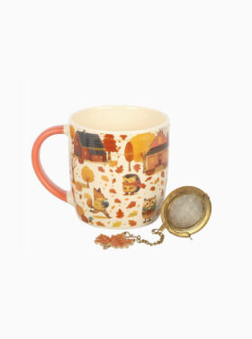 Tasse avec motifs de feuilles et de citrouilles d'automne et sa passoire à thé